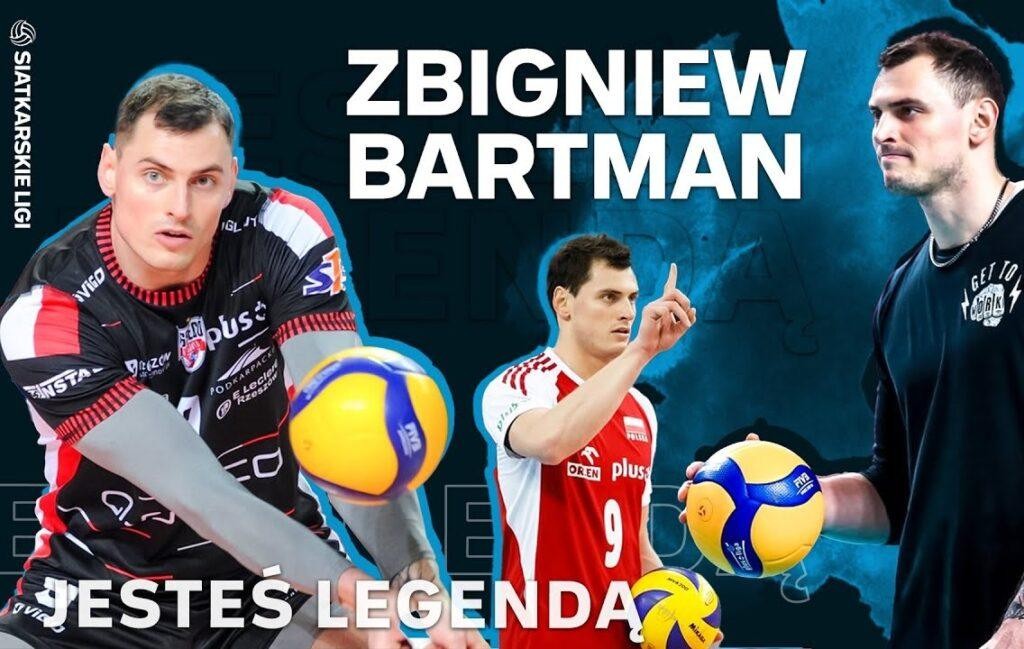 Zbigniew Bartman uśmiechnięty, trzymający piłkę siatkową, na tle rozmytego boiska.